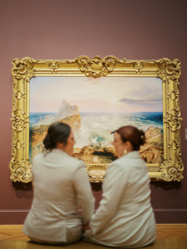 Legion of Honor wedding couple taking pictures inside the galleries 