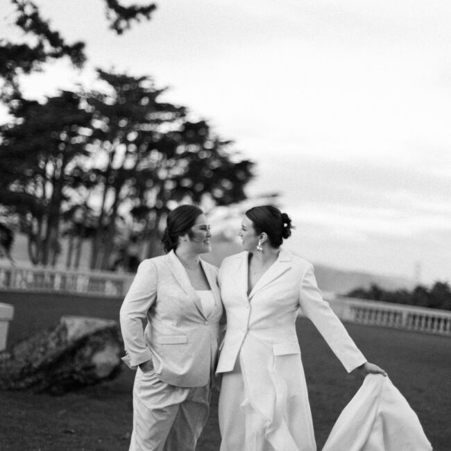 Legion of Honor wedding couple on lawn kissing